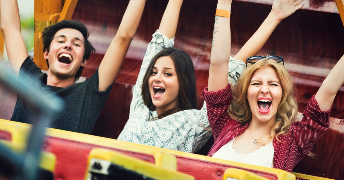 friends having fun on carnival ride