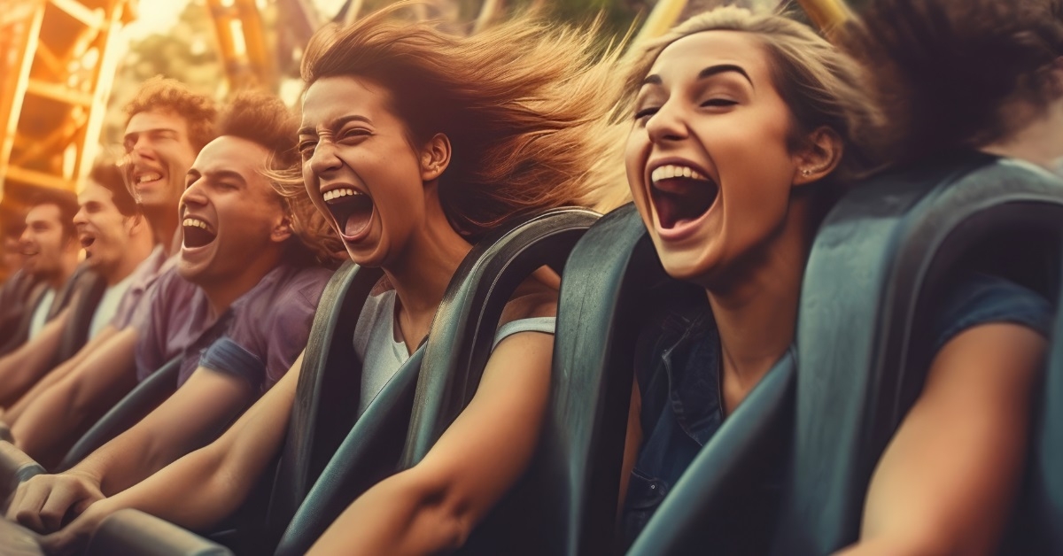 friends riding roller coaster together