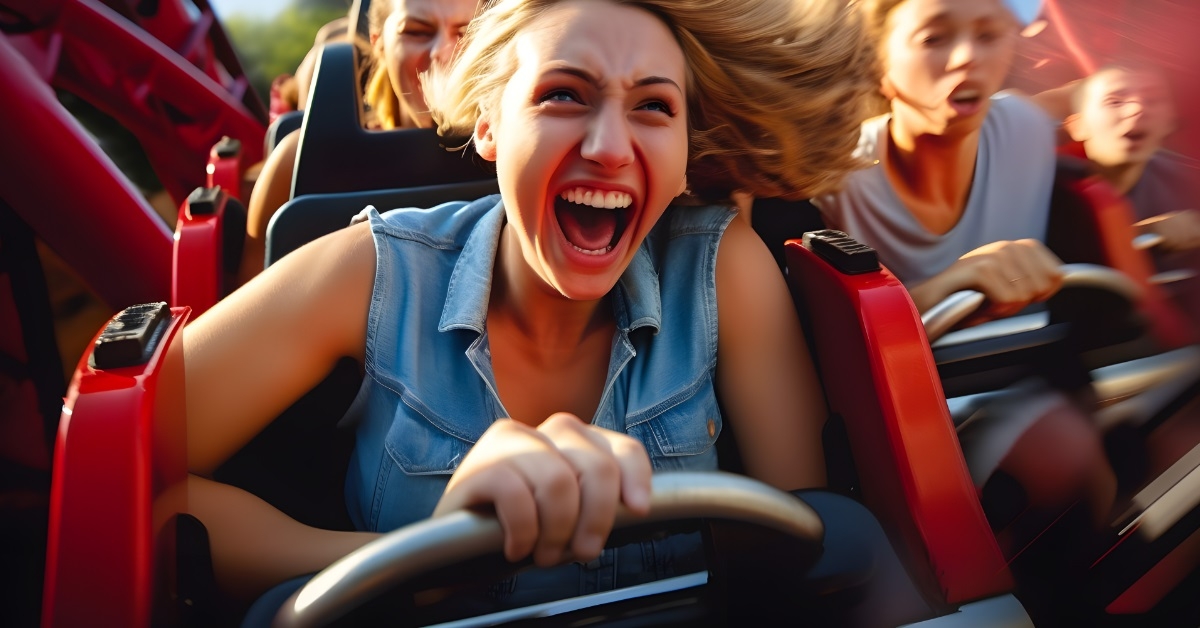 happy girl screaming on roller coaster