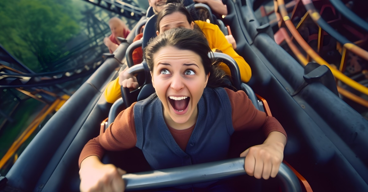 girl frightened while riding roller coaster