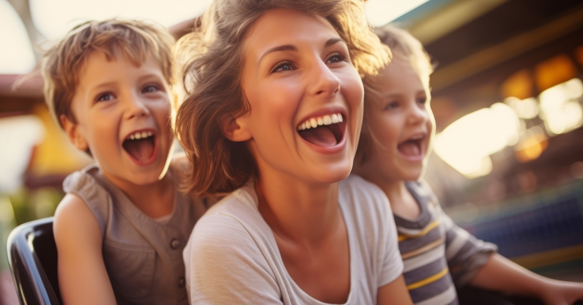 mother and kids enjoying roller coaster