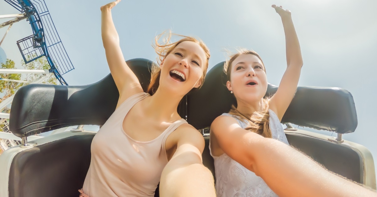 girls enjoying roller coaster ride