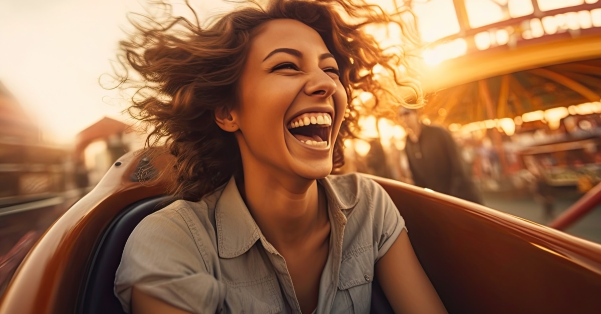 woman happy while riding roller coaster
