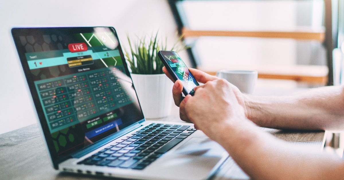 man using smartphone to bet online
