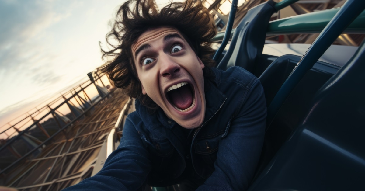 man screaming on roller coaster 