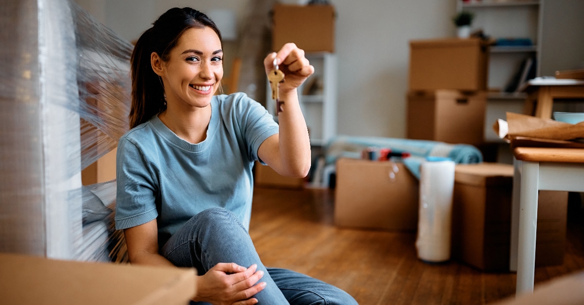 happy woman holding new house keys
