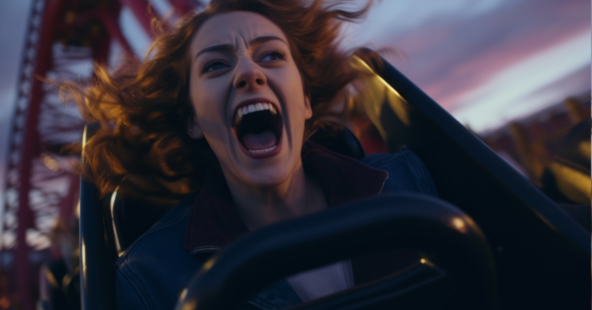 woman shocked while riding roller coaster