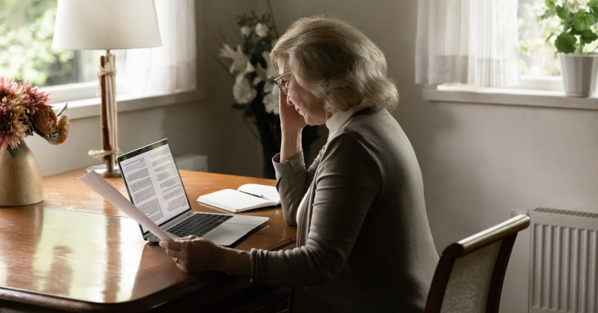 mature woman checking documents