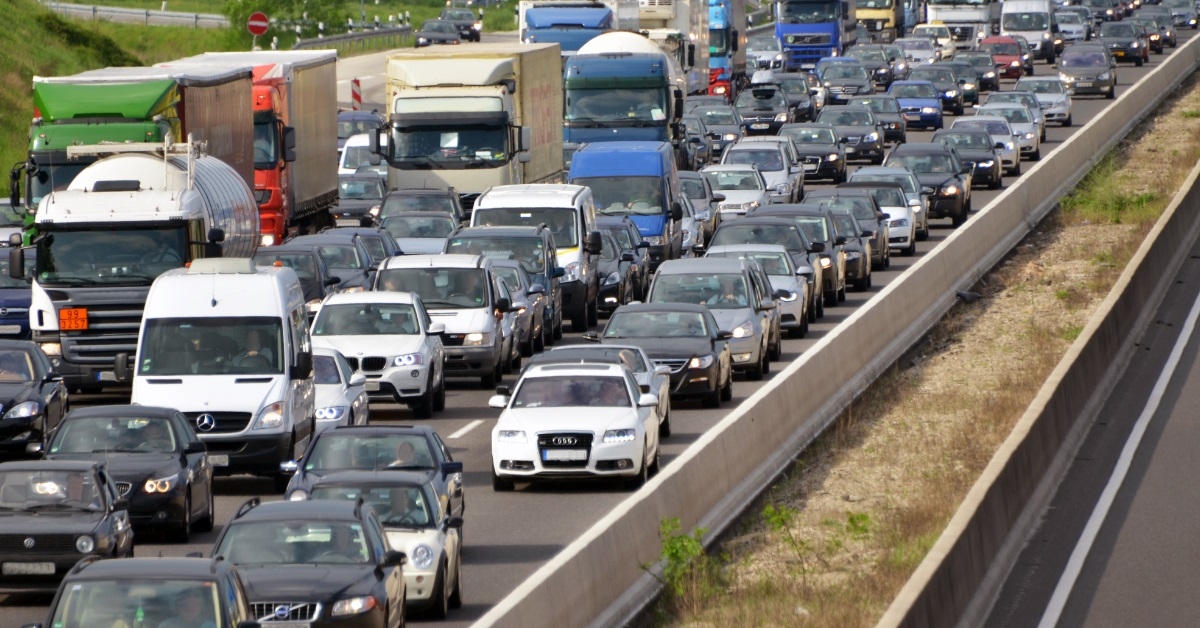 cars waiting in traffic at highway