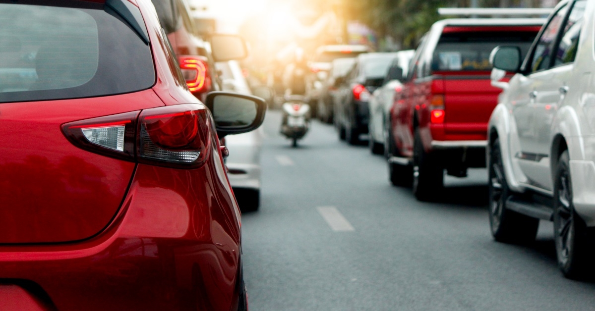 cars waiting in traffic in city