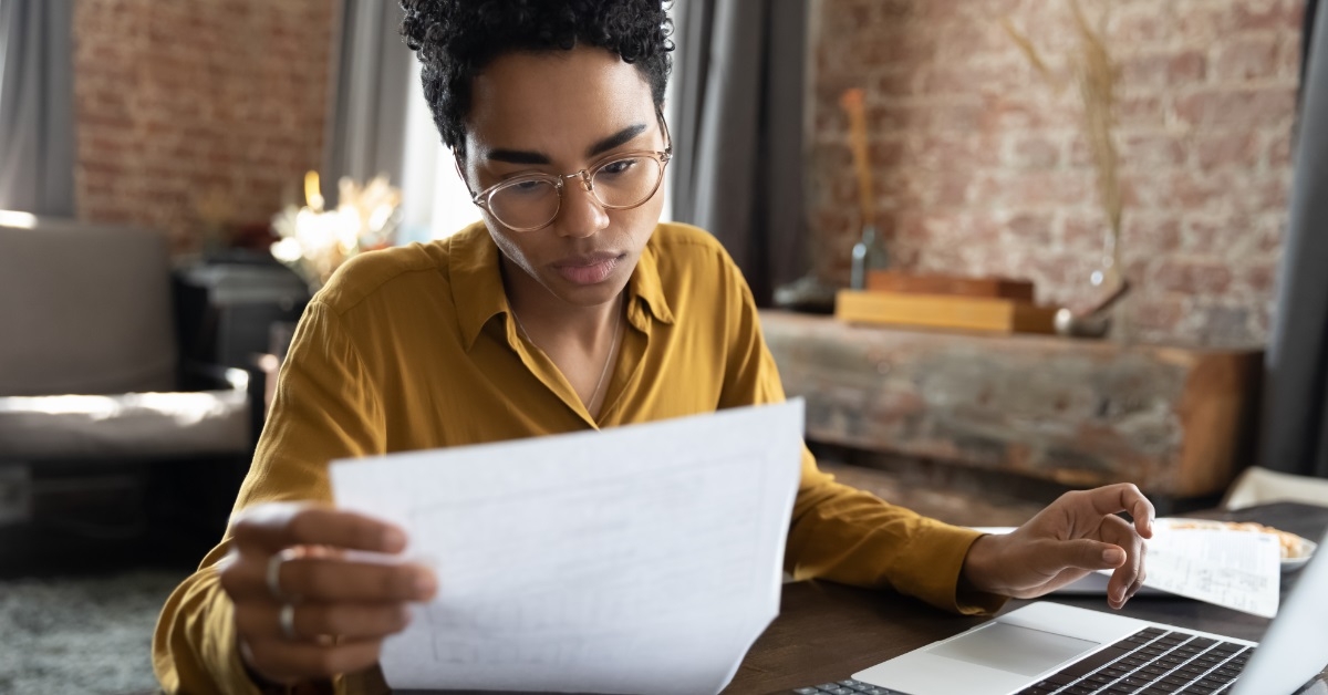 african american woman going through bills