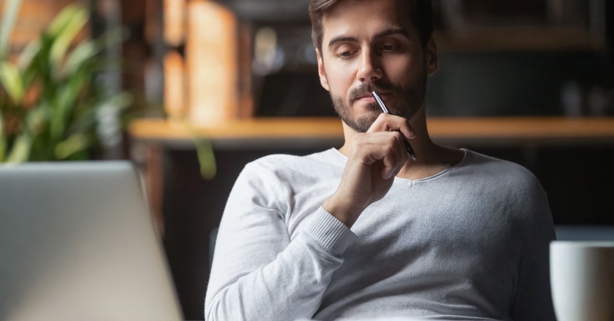 man working on laptop from home