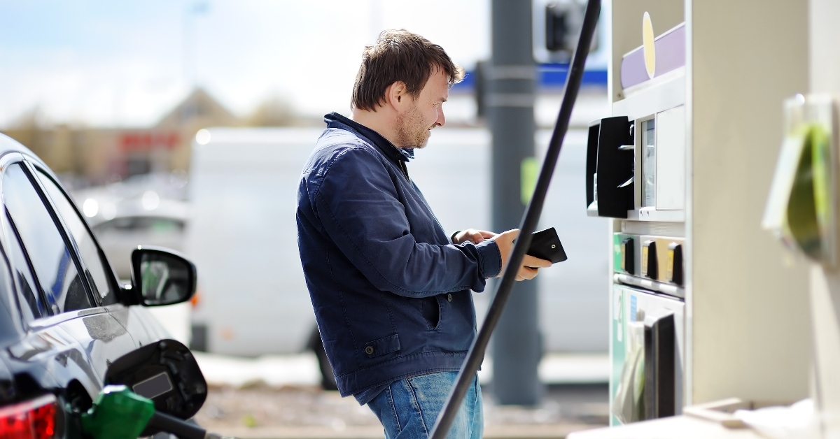 Man paying at gas pump