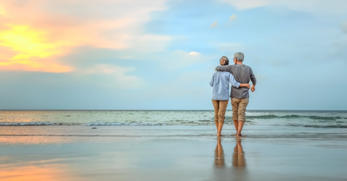 retired couple enjoying beach vacation