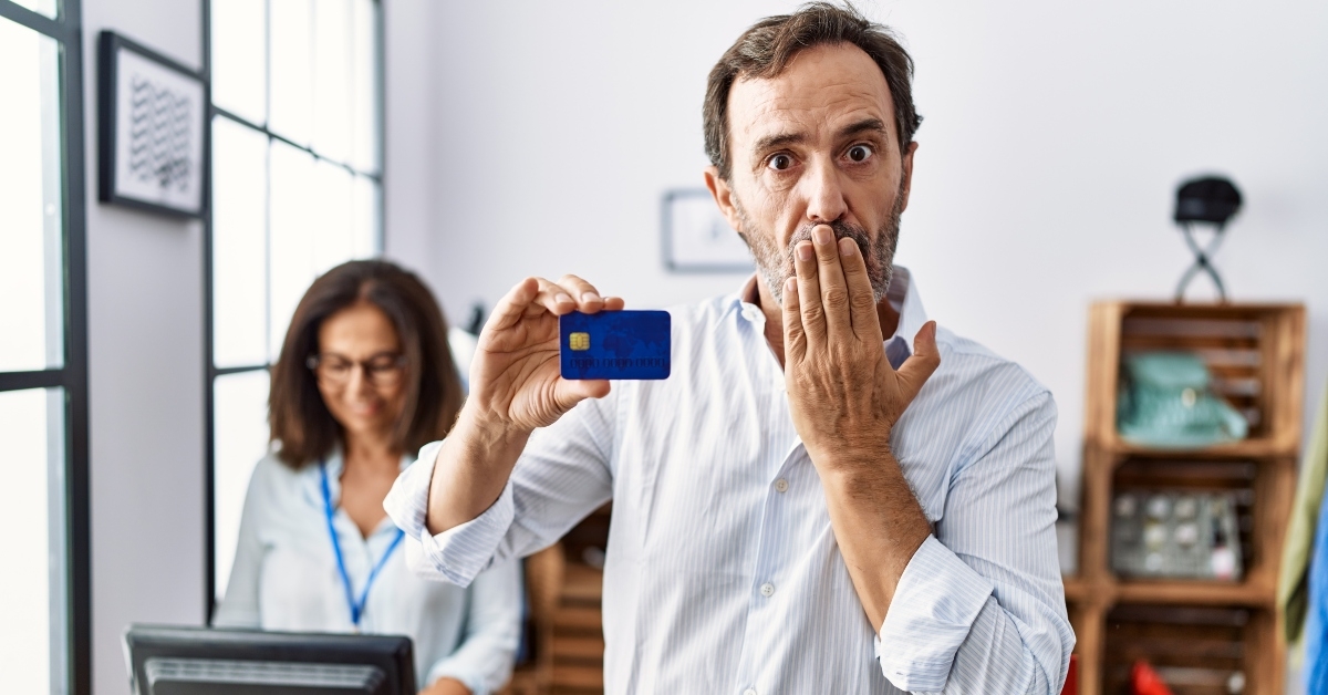man holding credit card