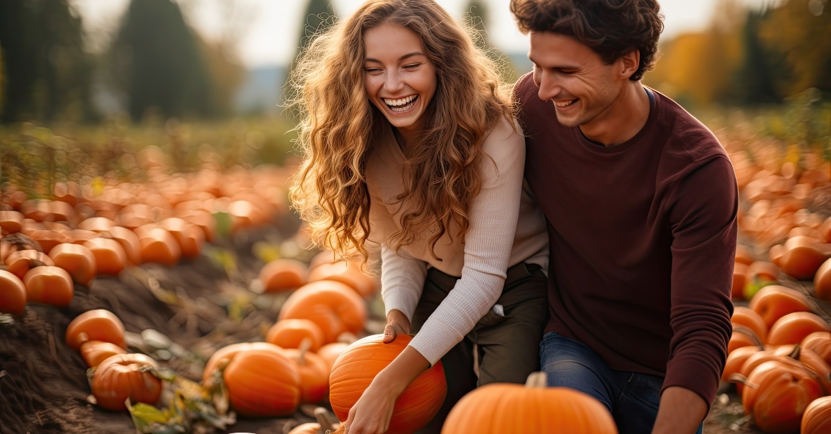 couple in pumpkin patch field