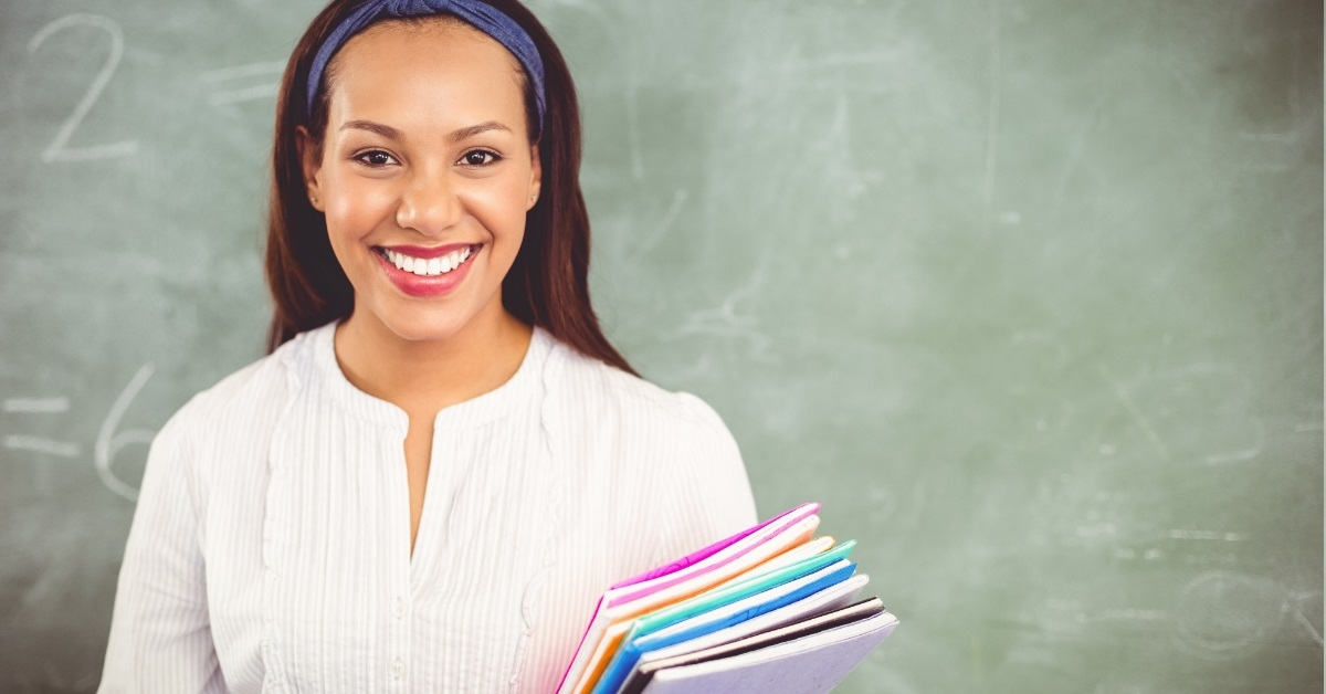school teacher smiling in class
