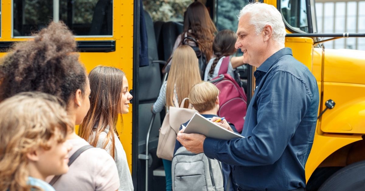 classmates going into school bus