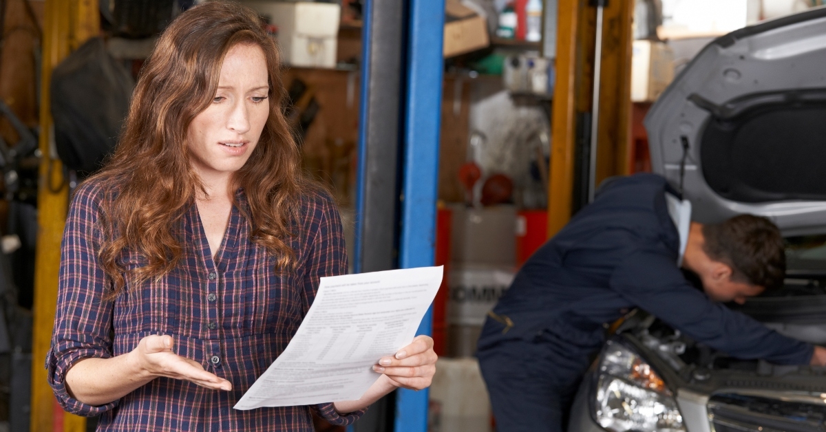 customer looking at garage bill
