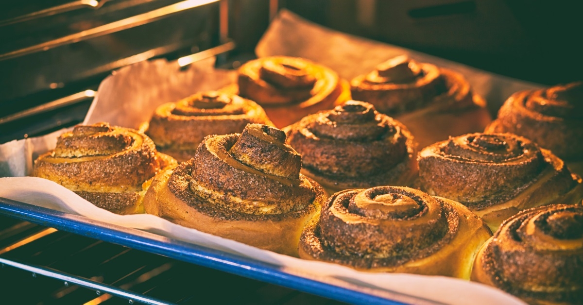 cinnamon rolls getting baked in oven