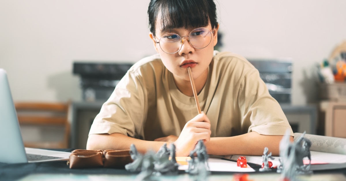 asian woman enjoying role playing tabletop