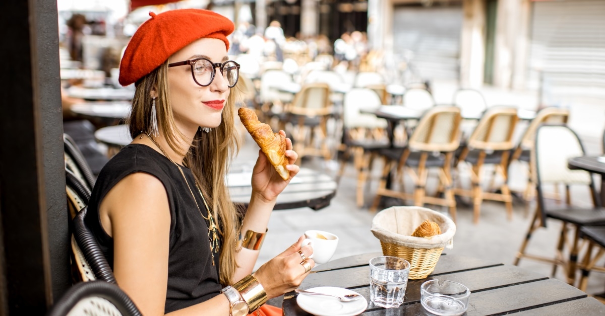 woman having in beret french breakfast