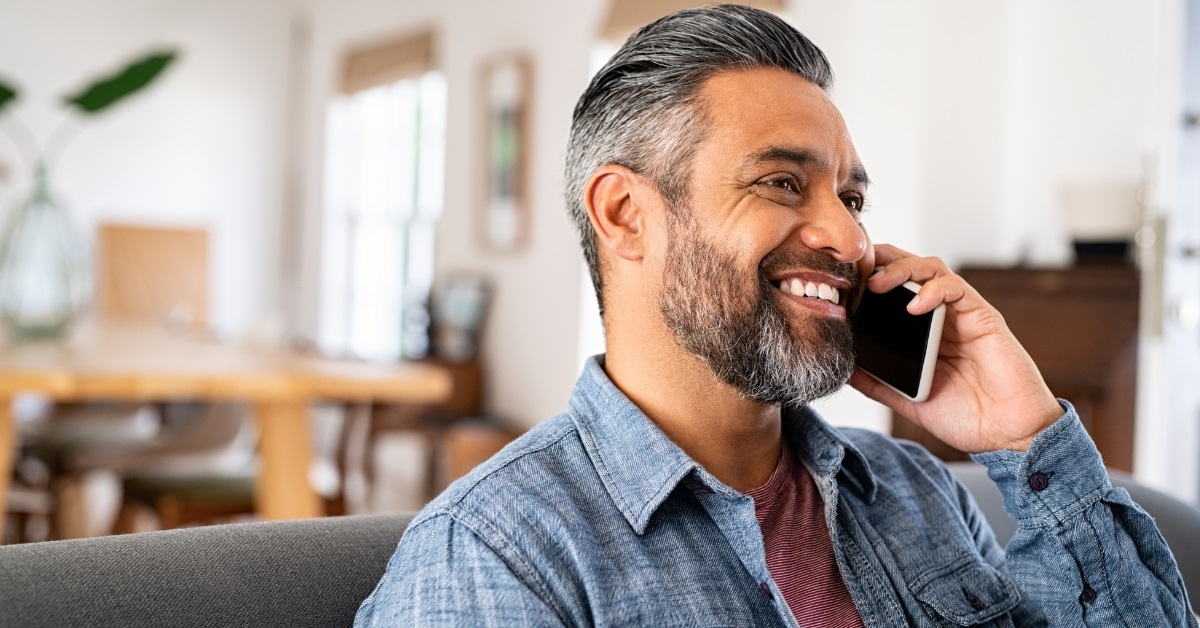 handsome mature man talking on phone