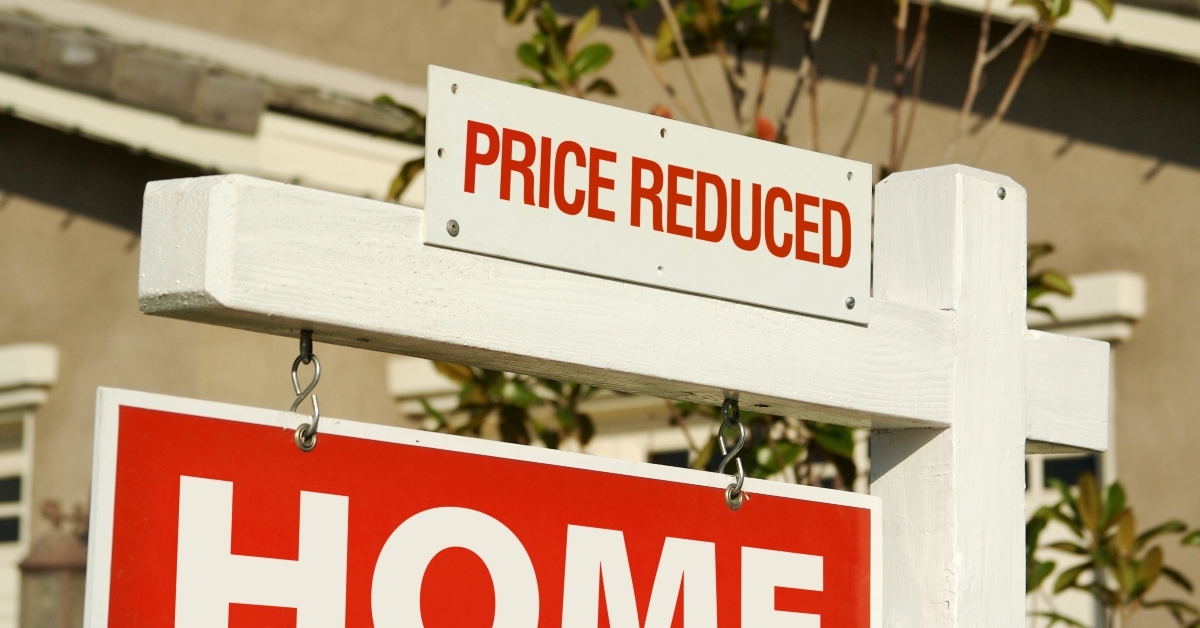 price reduced real estate sign