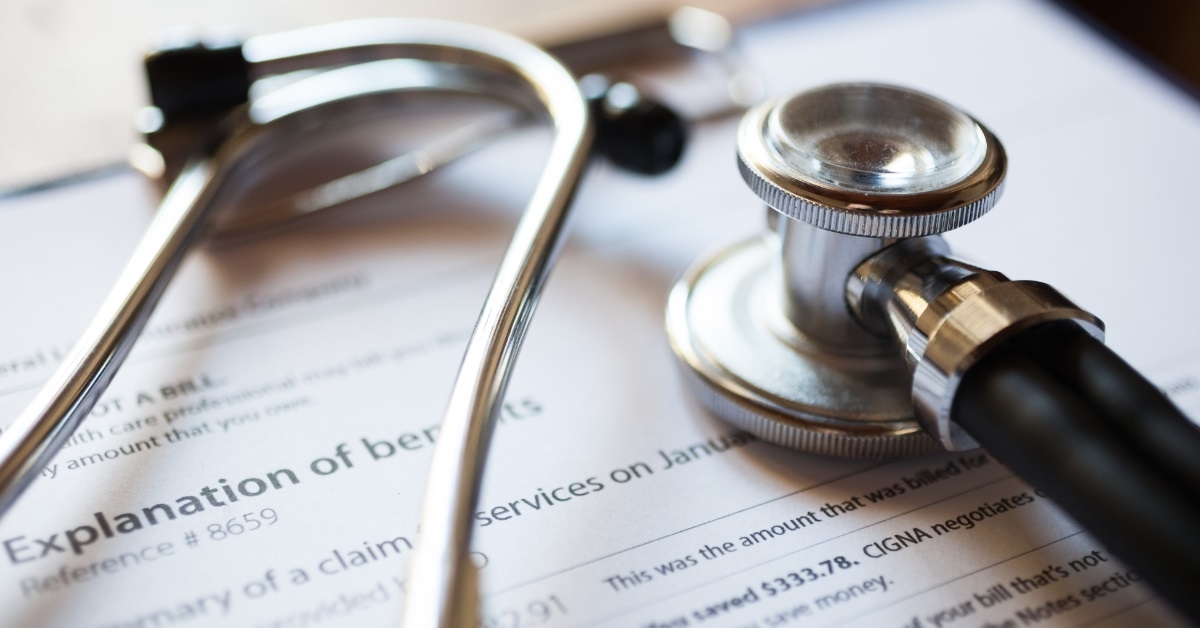stethoscope over medical documents at table