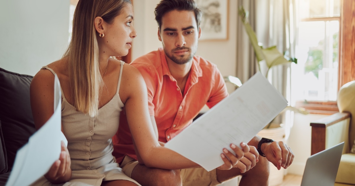 young couple arguing about utility bills