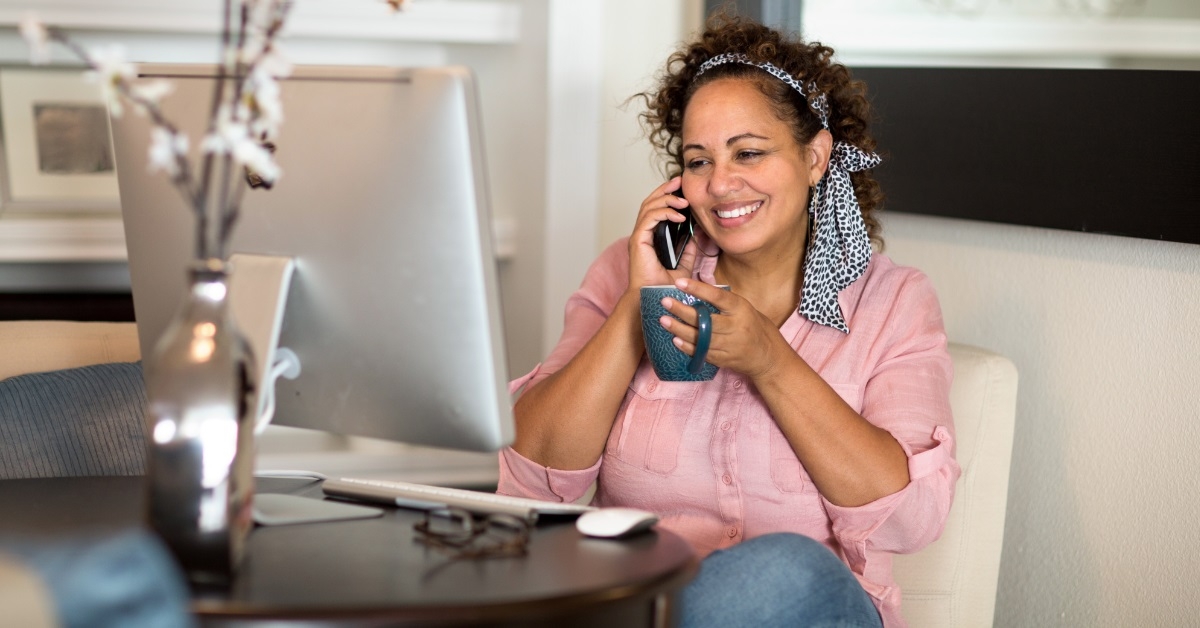 woman enjoying tea while on call