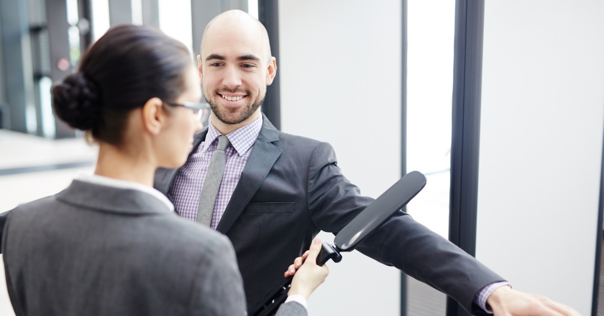 female airport security scanning businessman 
