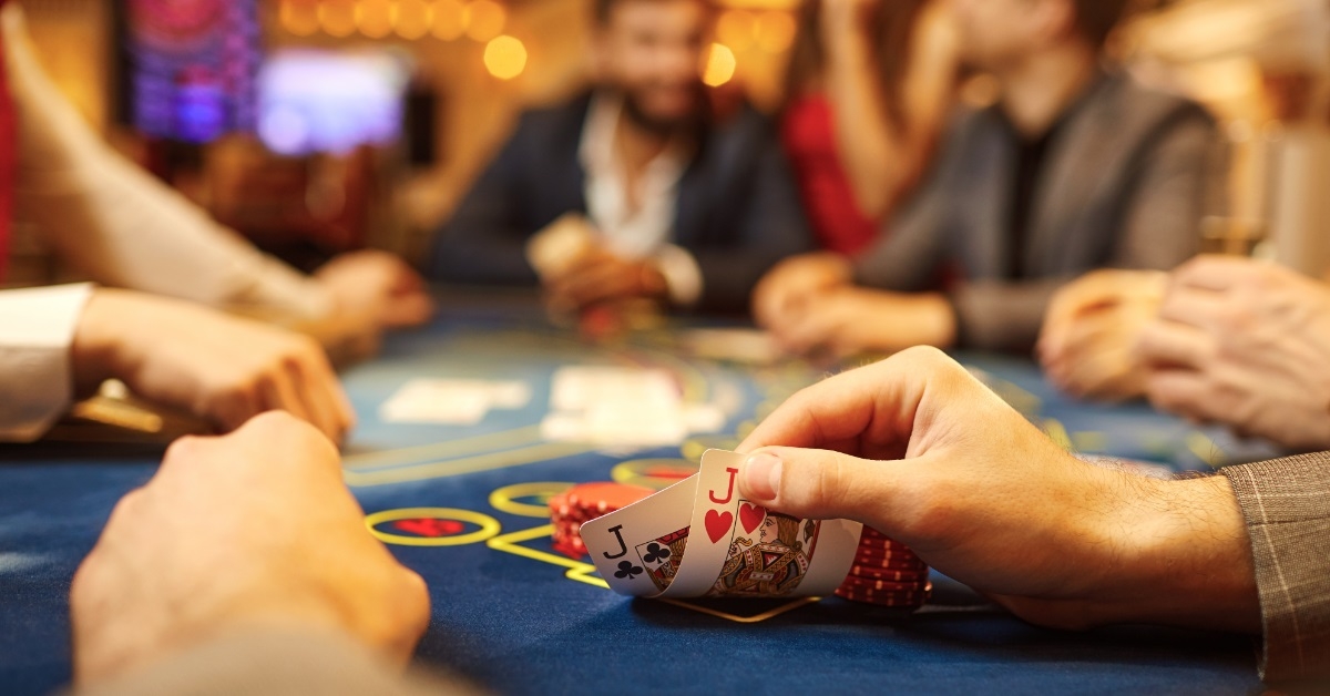 people playing poker at casino table