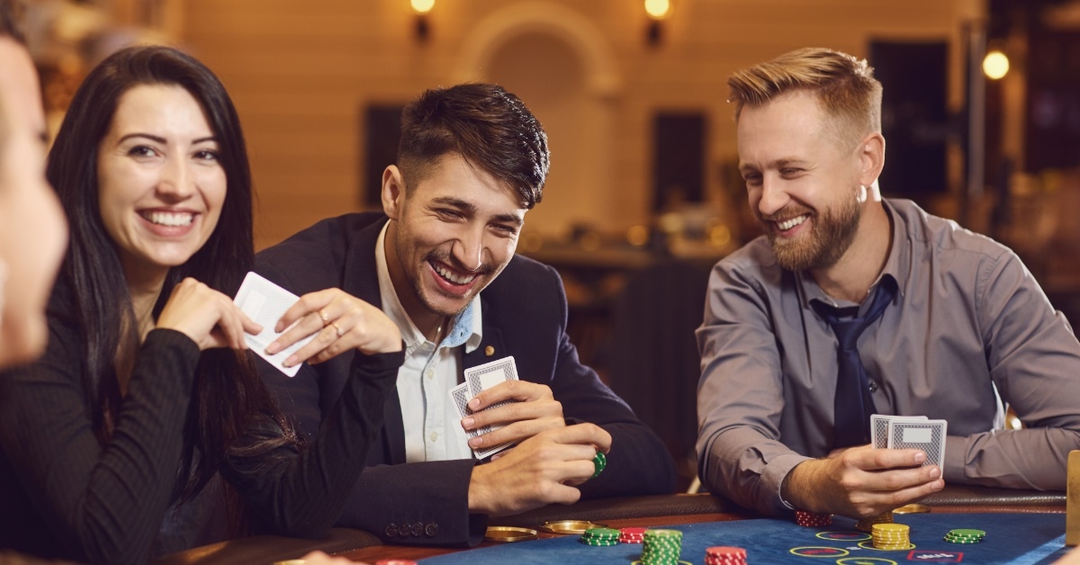 happy young people gambling at casino