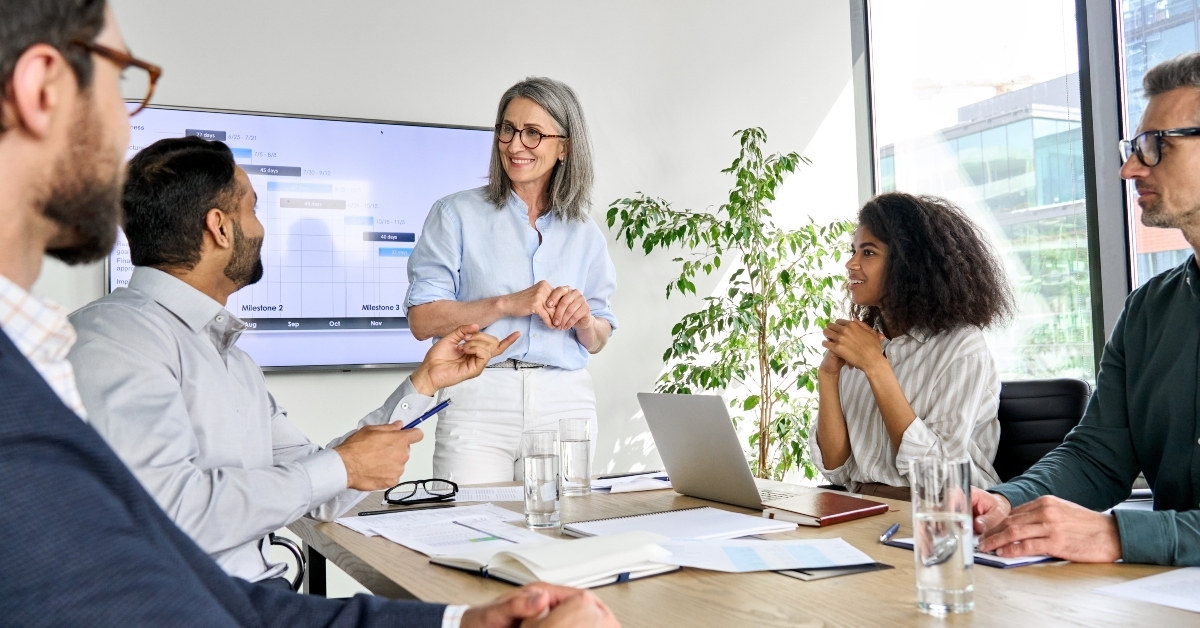 executive team people having board meeting
