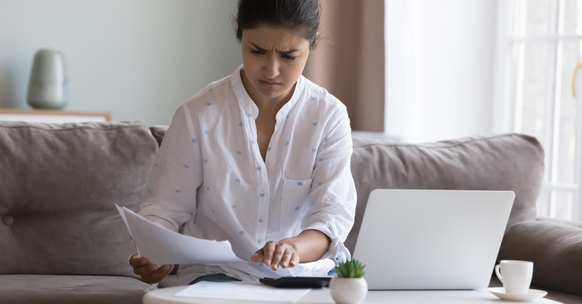Indian woman sorts out household bills