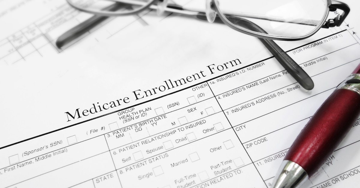 medical enrollment form with pen