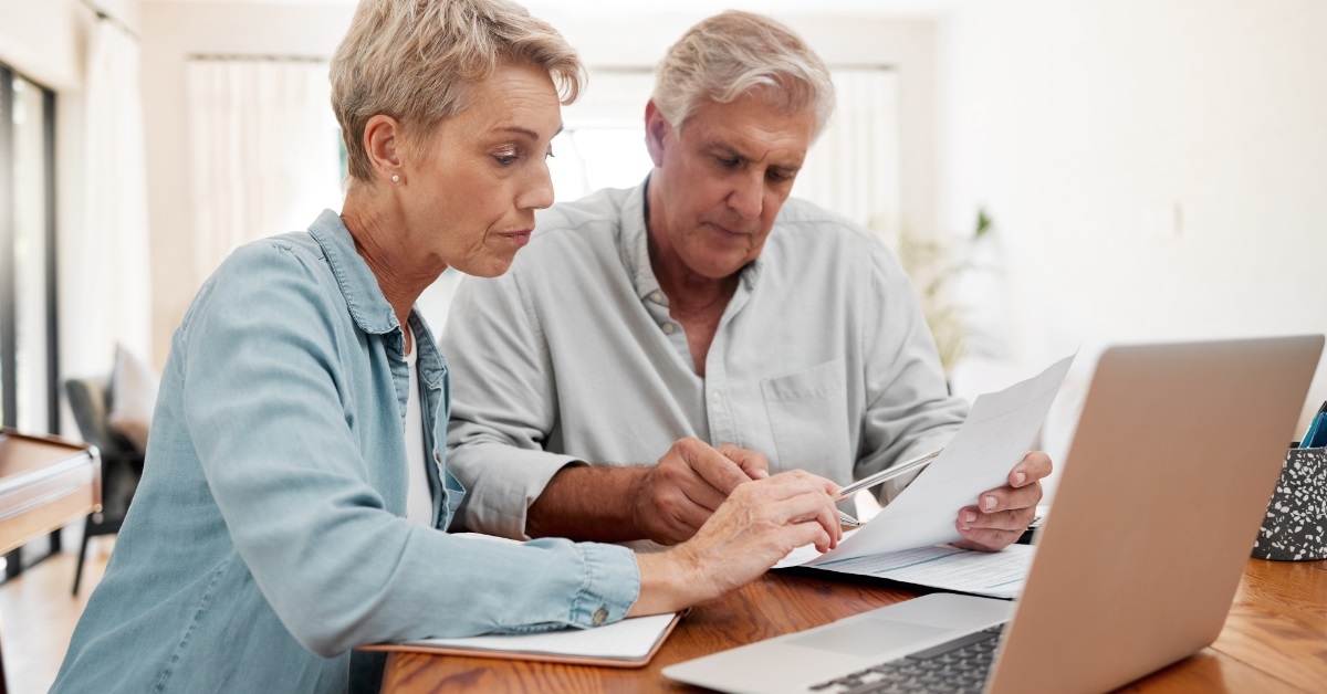 senior couple reviewing bills together