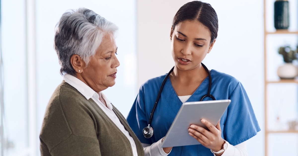 senior woman consulting doctor using tablet
