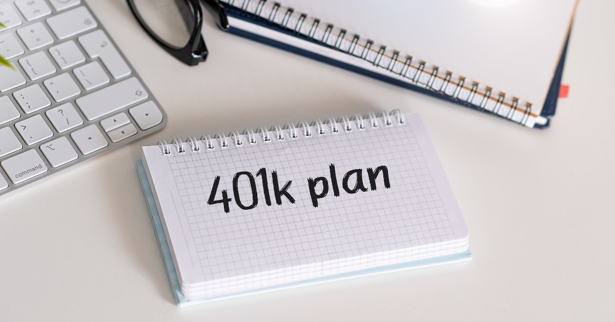 401K plan on notebook besides keyboard