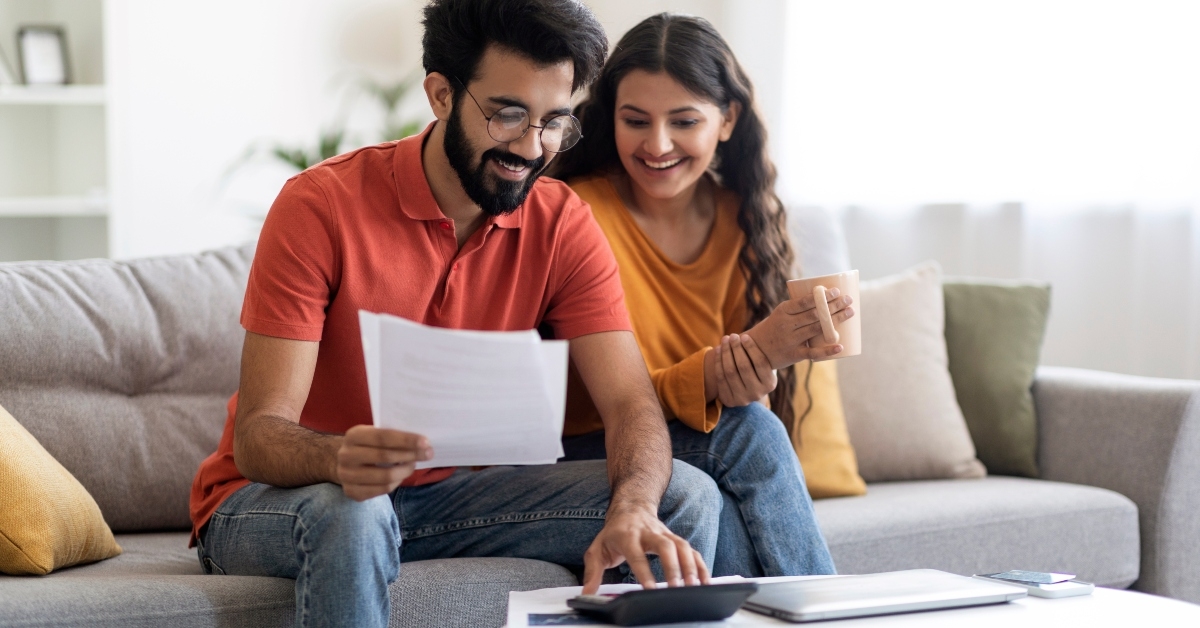 indian spouses checking financial documents