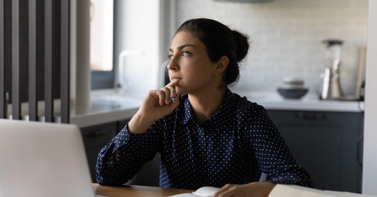 woman thinking while doing study
