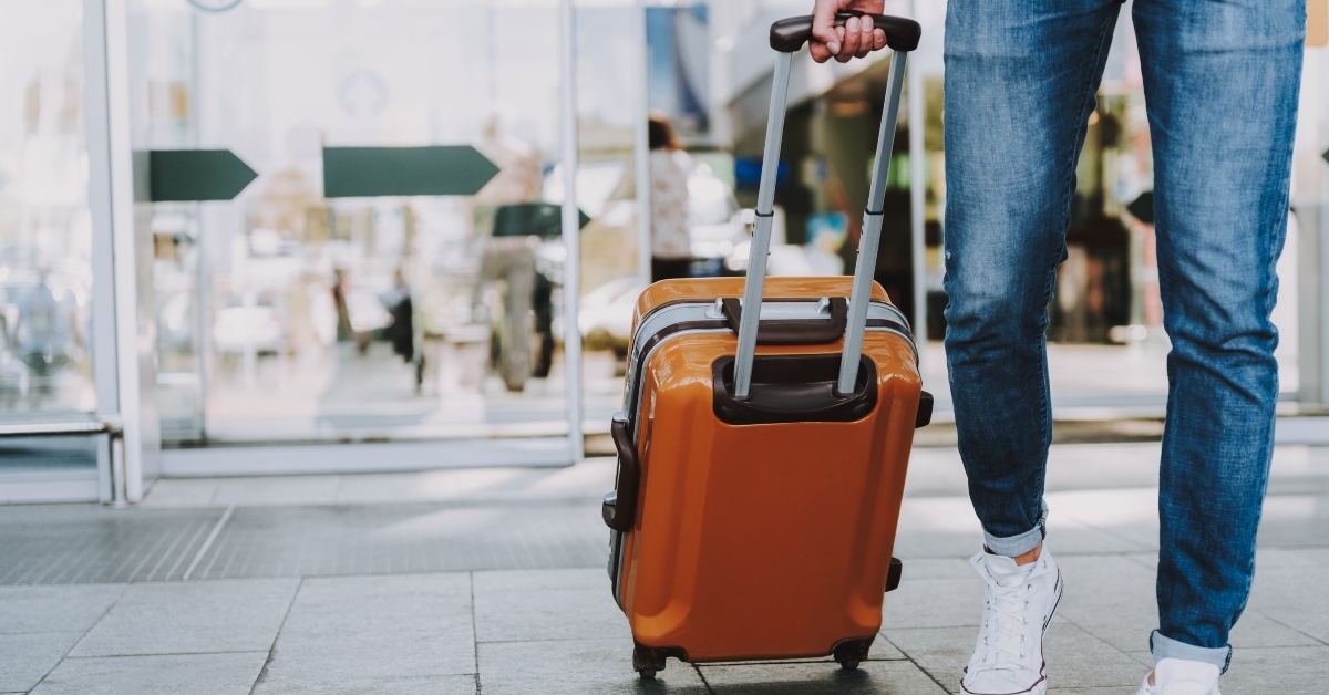 carrying luggage in hall