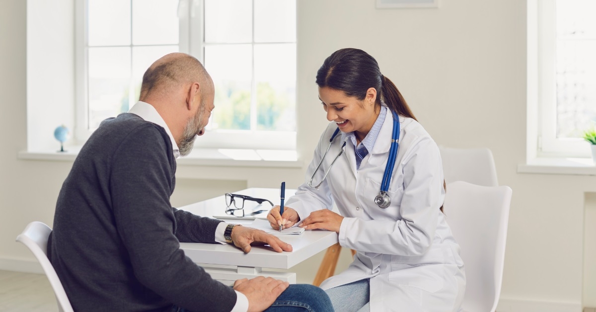 female doctor writing medication for patient