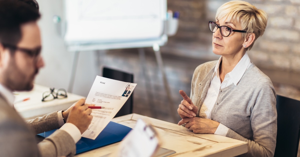 senior woman interviewing job applicants