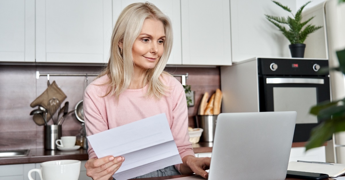 senior woman reviewing bills