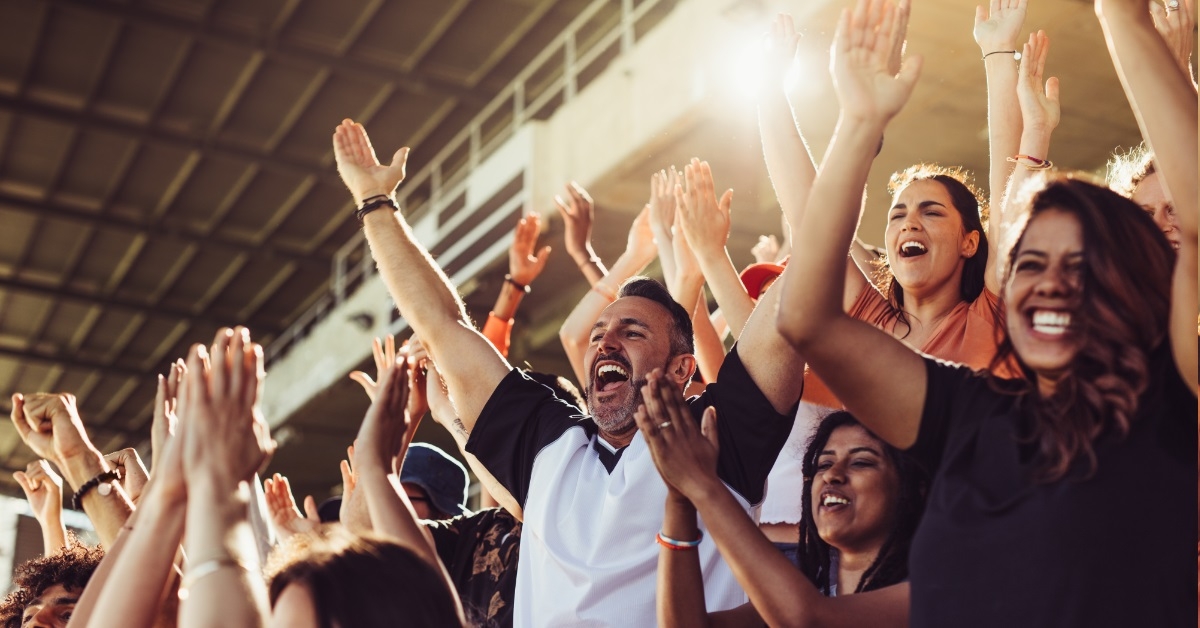 crowd cheering during match at stadium