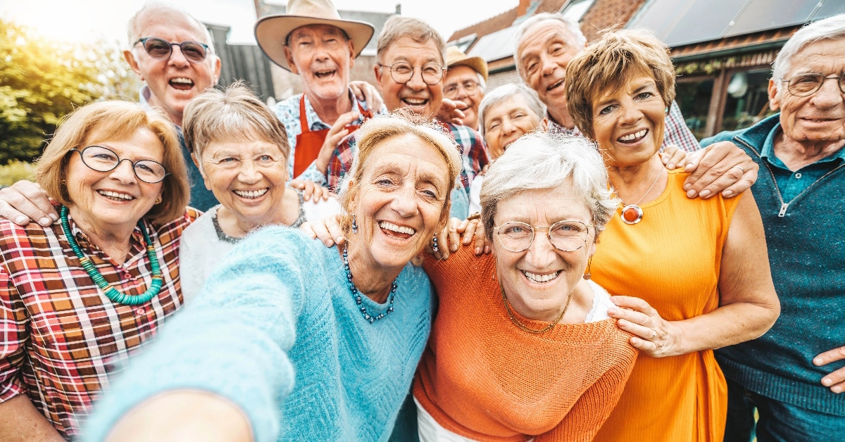 group of senior people smiling for a picture.