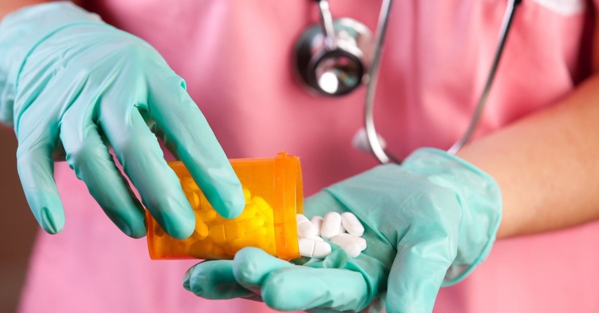 healthcare worker pouring medicines