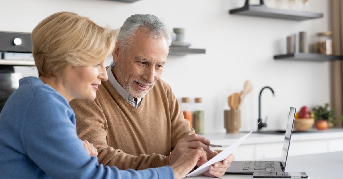 senior couple reviewing bills together